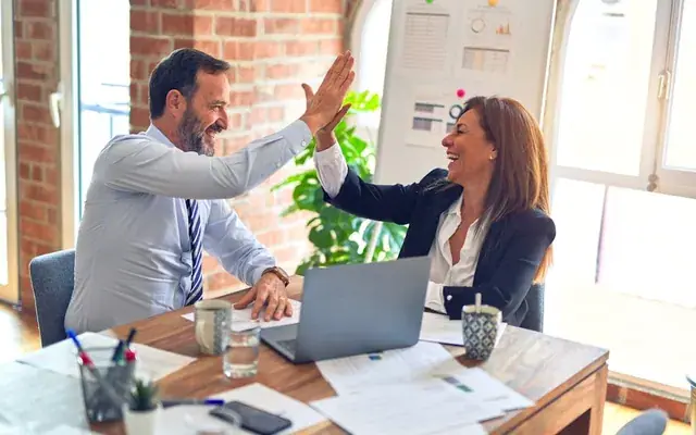 Advisor celebrating results with a student